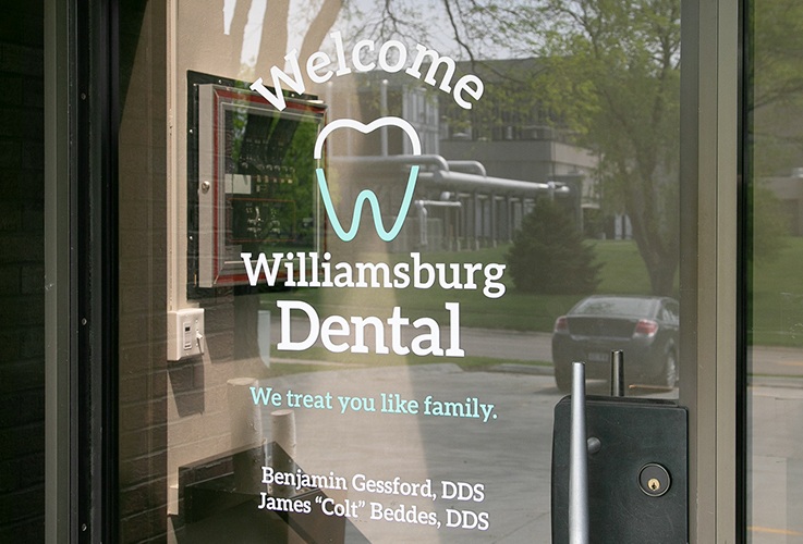 Williamsburg Dental logo on dental office entry door