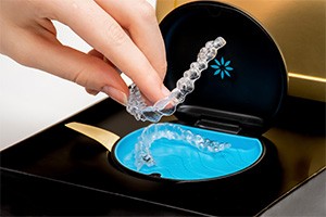 an invisalign welcome kit with trays and a case