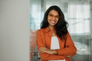 beautiful, smiling young woman in an office setting